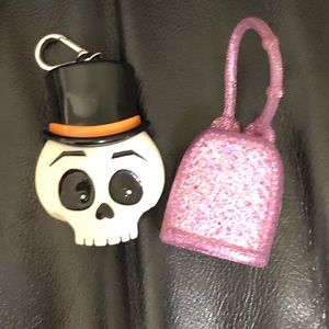 2 bath & body works hand sanitizer holders.